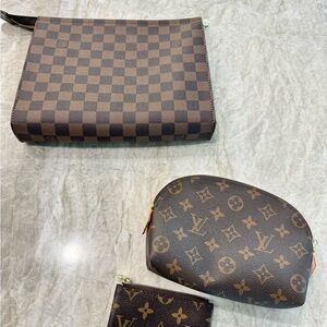Louis Vuitton toiletry pouch, coin bag, and clutch bundle found at estate sale